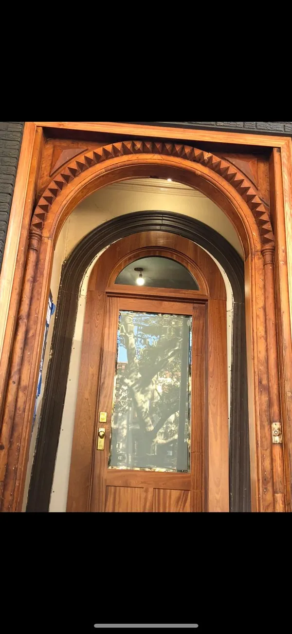 Restored historic wood entry door by MMSL Contracting Corp