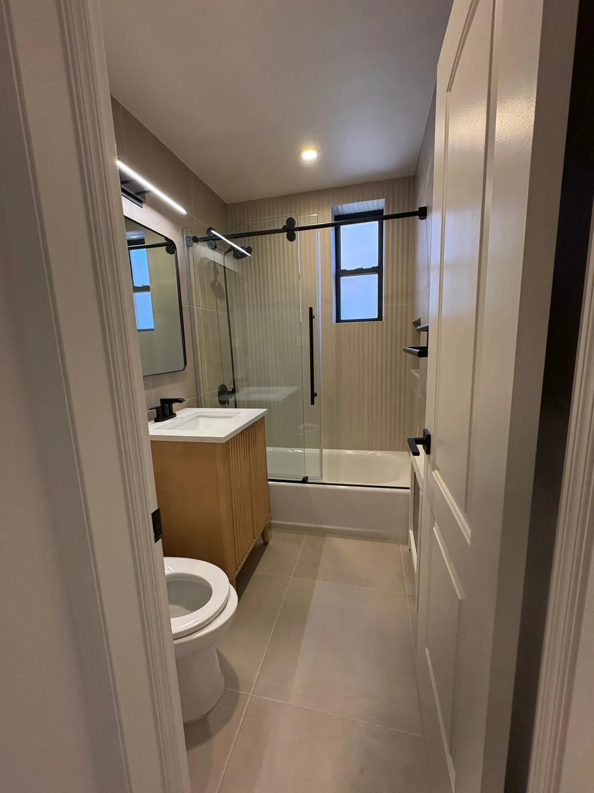 Completed Great Neck bathroom renovation viewed from the doorway