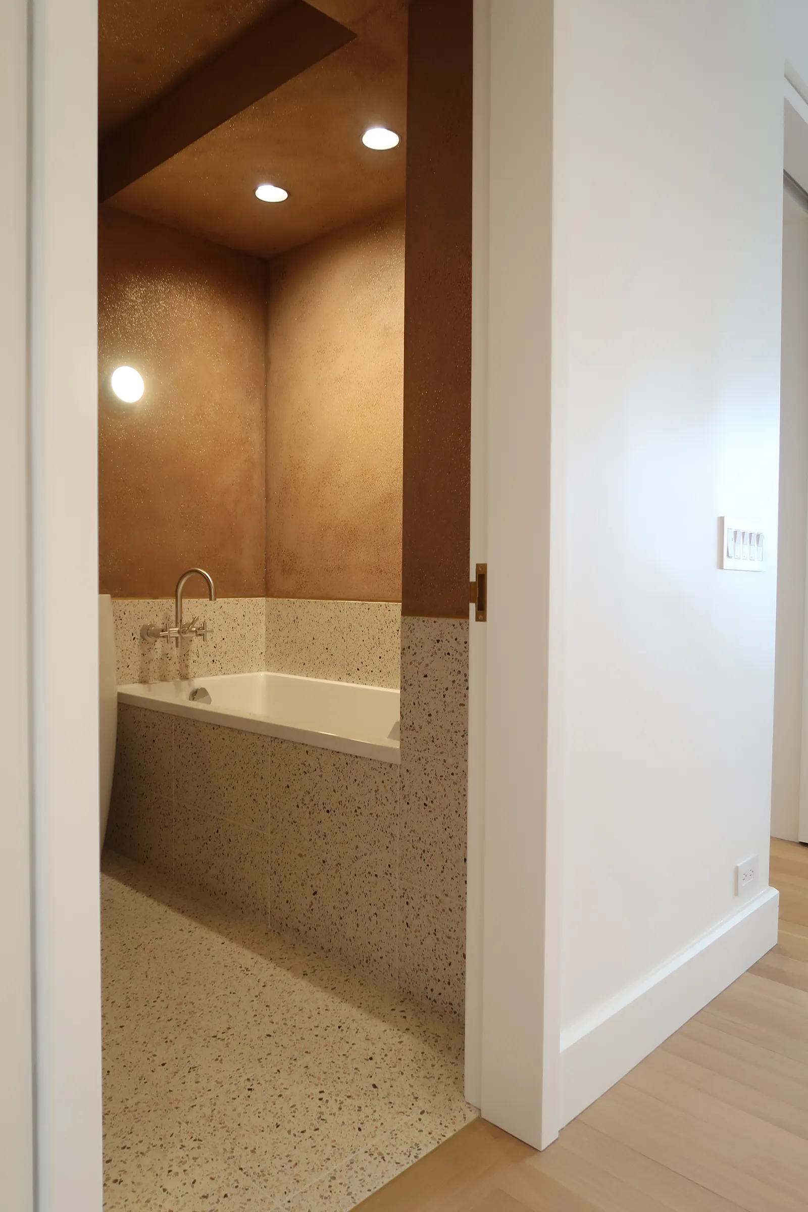 Terrazzo shower and recessed lighting in the Lafayette Residence bathroom