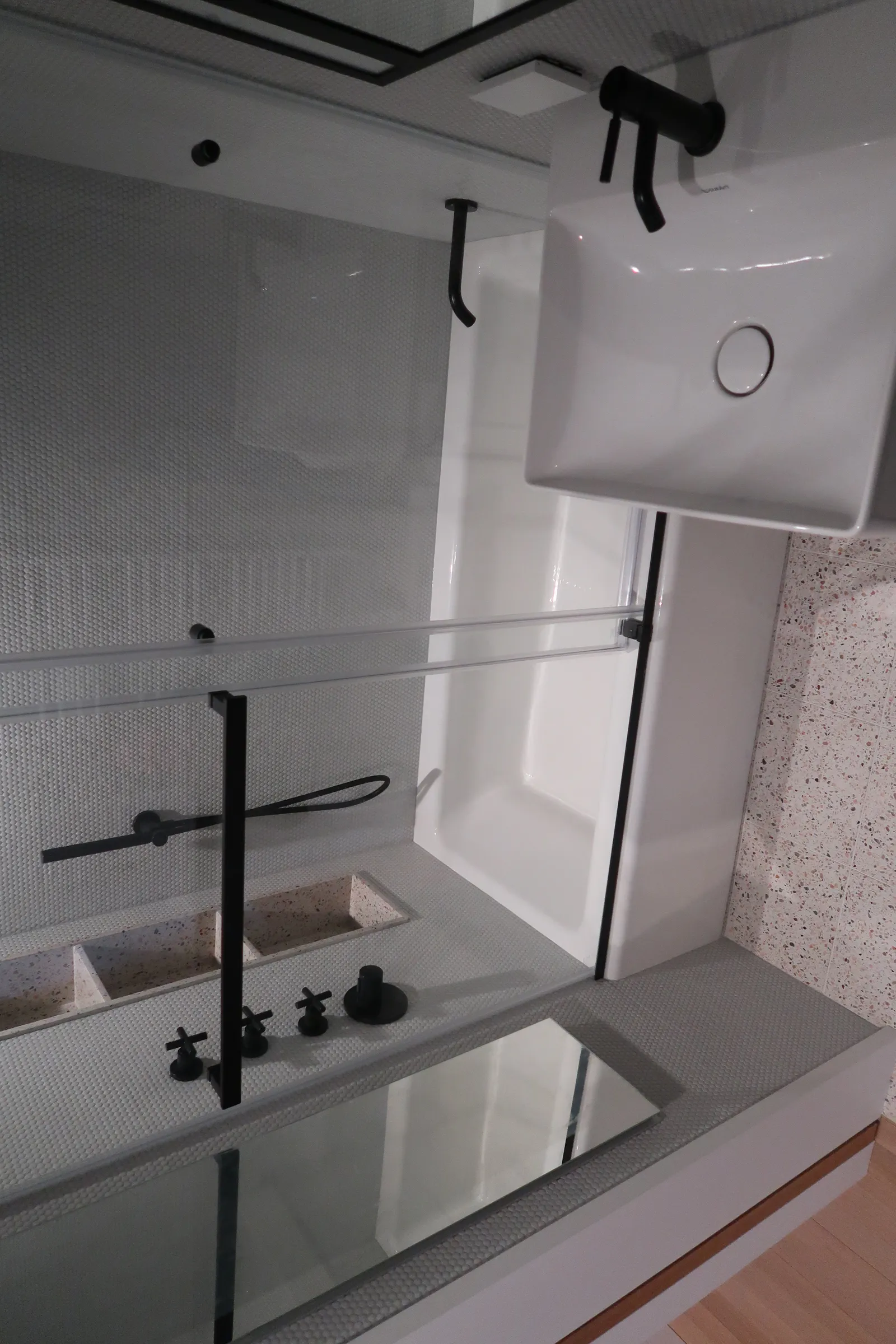 Lafayette Residence bathroom with a glass tub enclosure and terrazzo floor