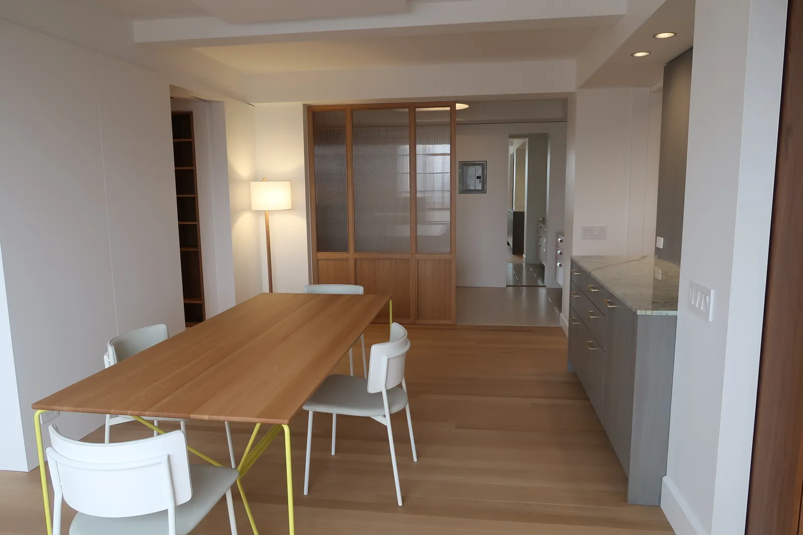 Lafayette Residence dining room with a custom wood and glass divider