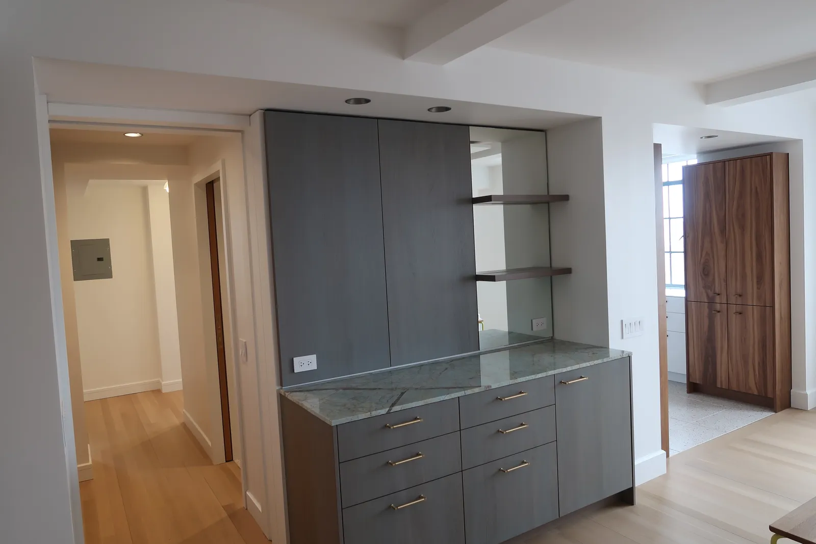 Custom gray built-in cabinetry and display shelving at the Lafayette Residence