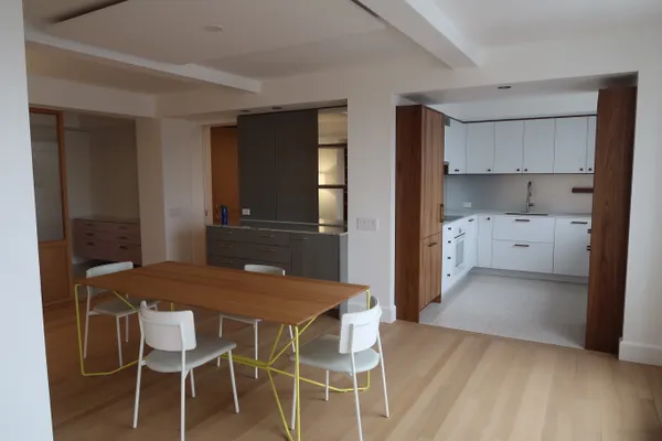 Custom kitchen with walnut millwork remodeled by MMSL Contracting Corp