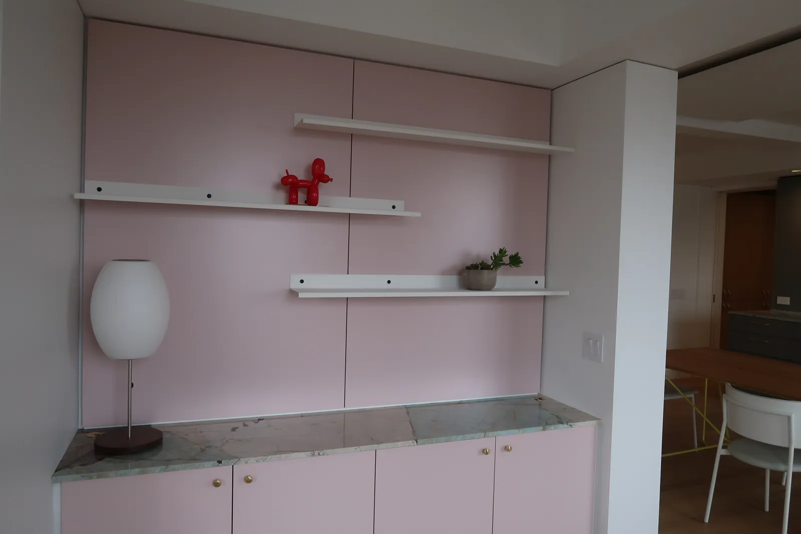 Custom pink built-in cabinet and shelving at the Lafayette Residence